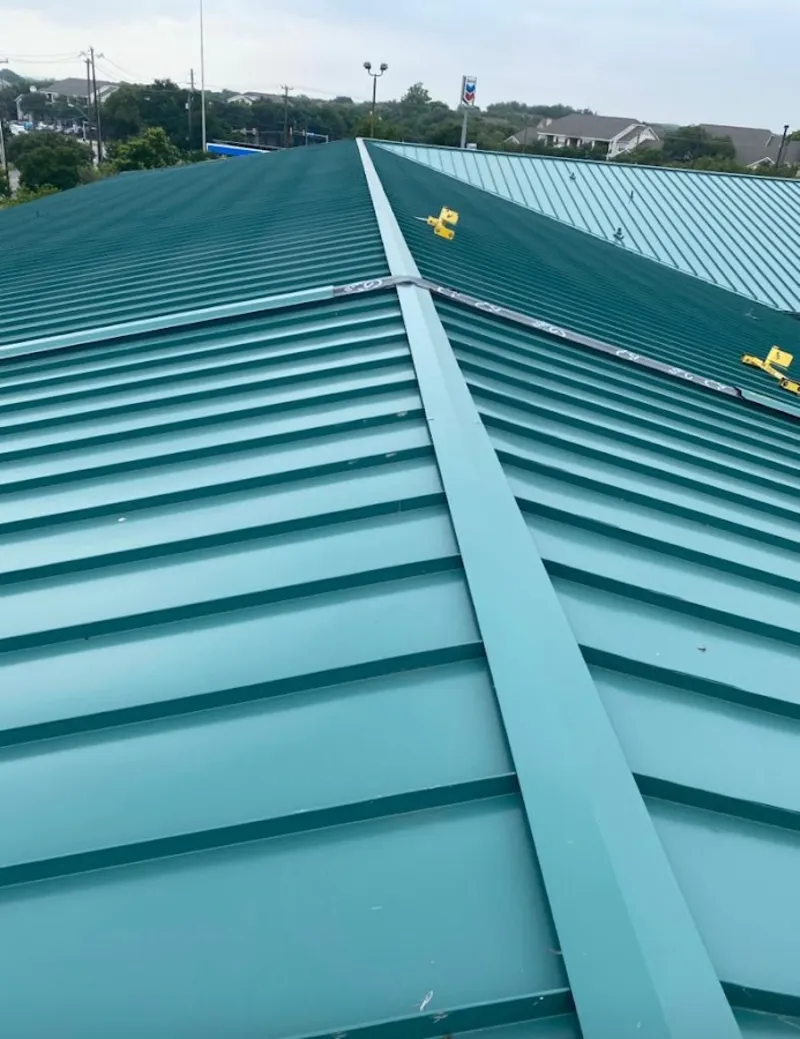 Green commercial metal roof ridge and valley for Metal Roof Repair in Meadow Woods